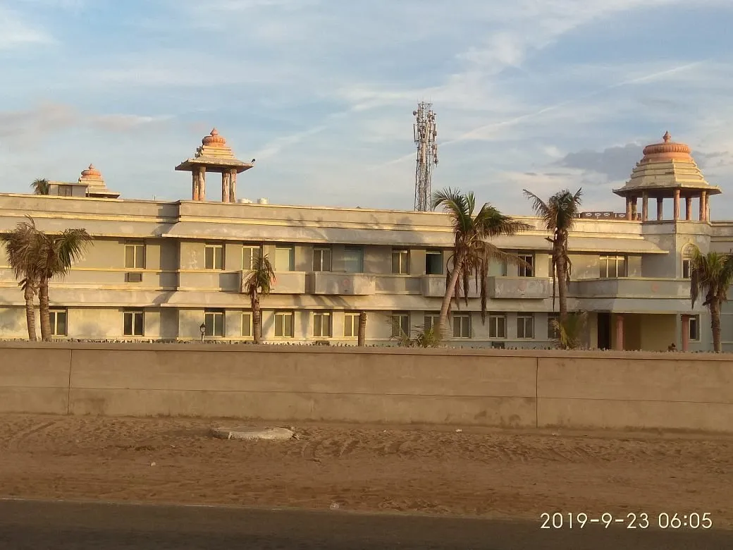The sea-side facade of Birla Guest House with its temple-style pavilions, seen from Marine Drive Road